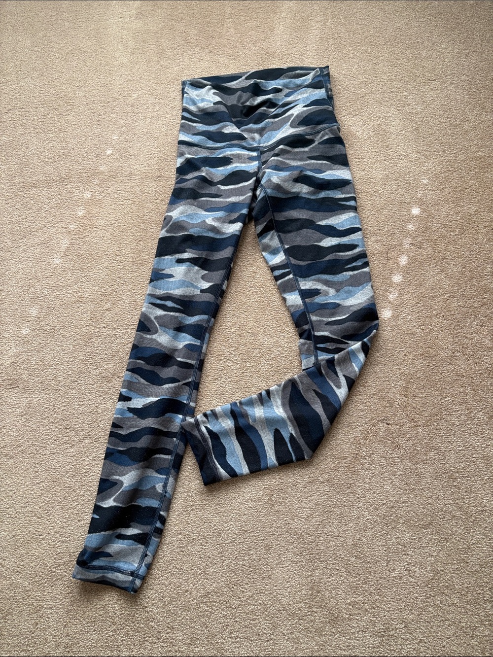 Women’s Lululemon blue and grey camo leggings.
